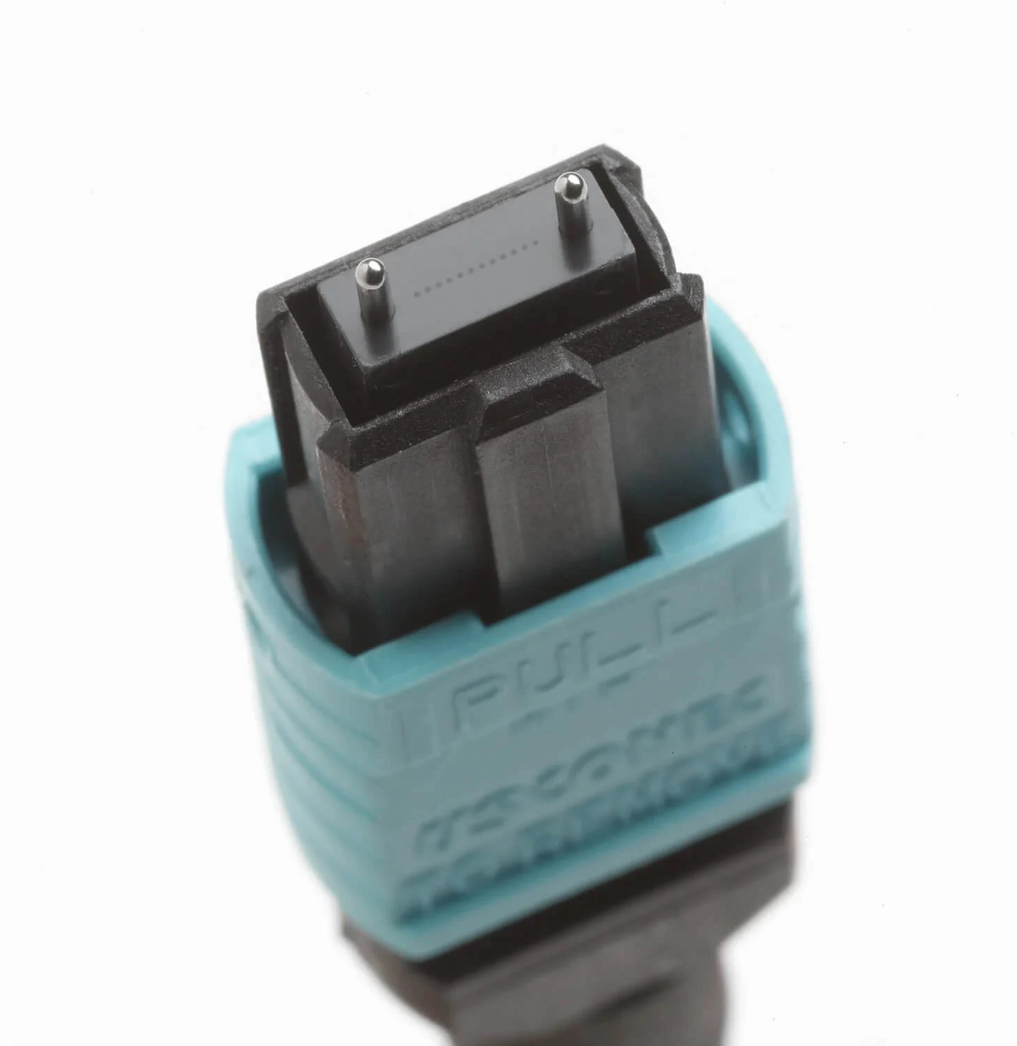 Close-up of a pinned male MPO connector end face